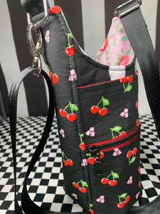 Cherries on black print drink bottle crossbody bag