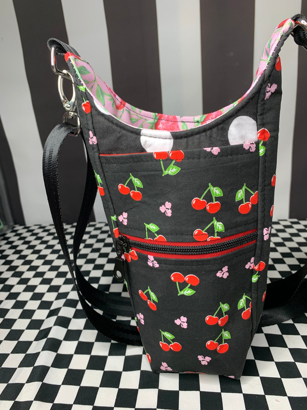 Cherries on black print drink bottle crossbody bag