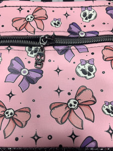 Skulls and bows pink crossbody bag